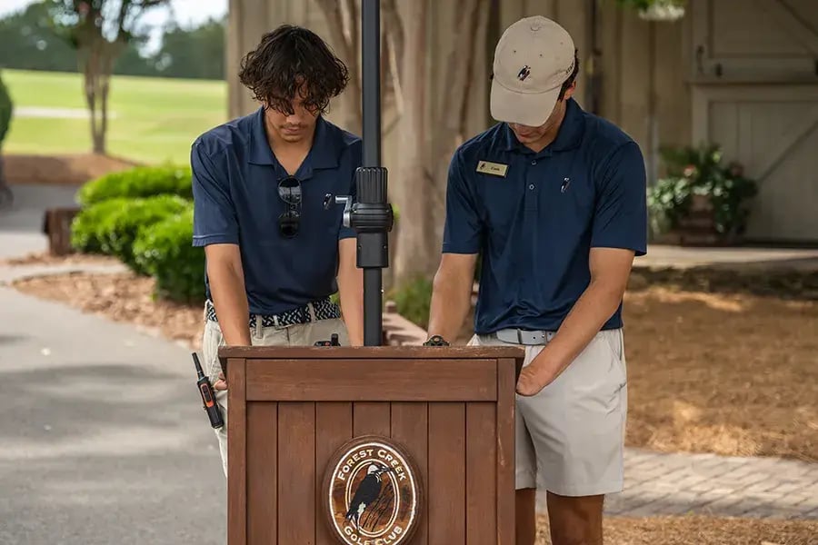 caddies looking at list