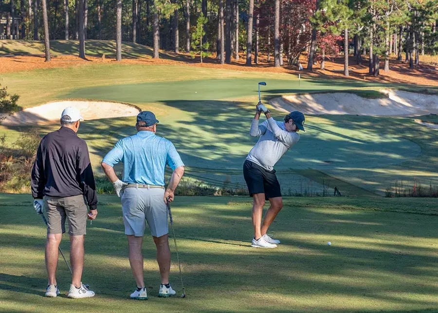 golfers at hog hole